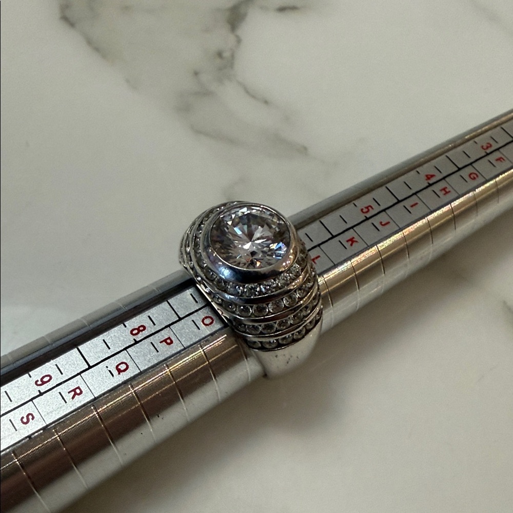 Jean Dousset graduated channel ring, sterling silver with CZ accents
